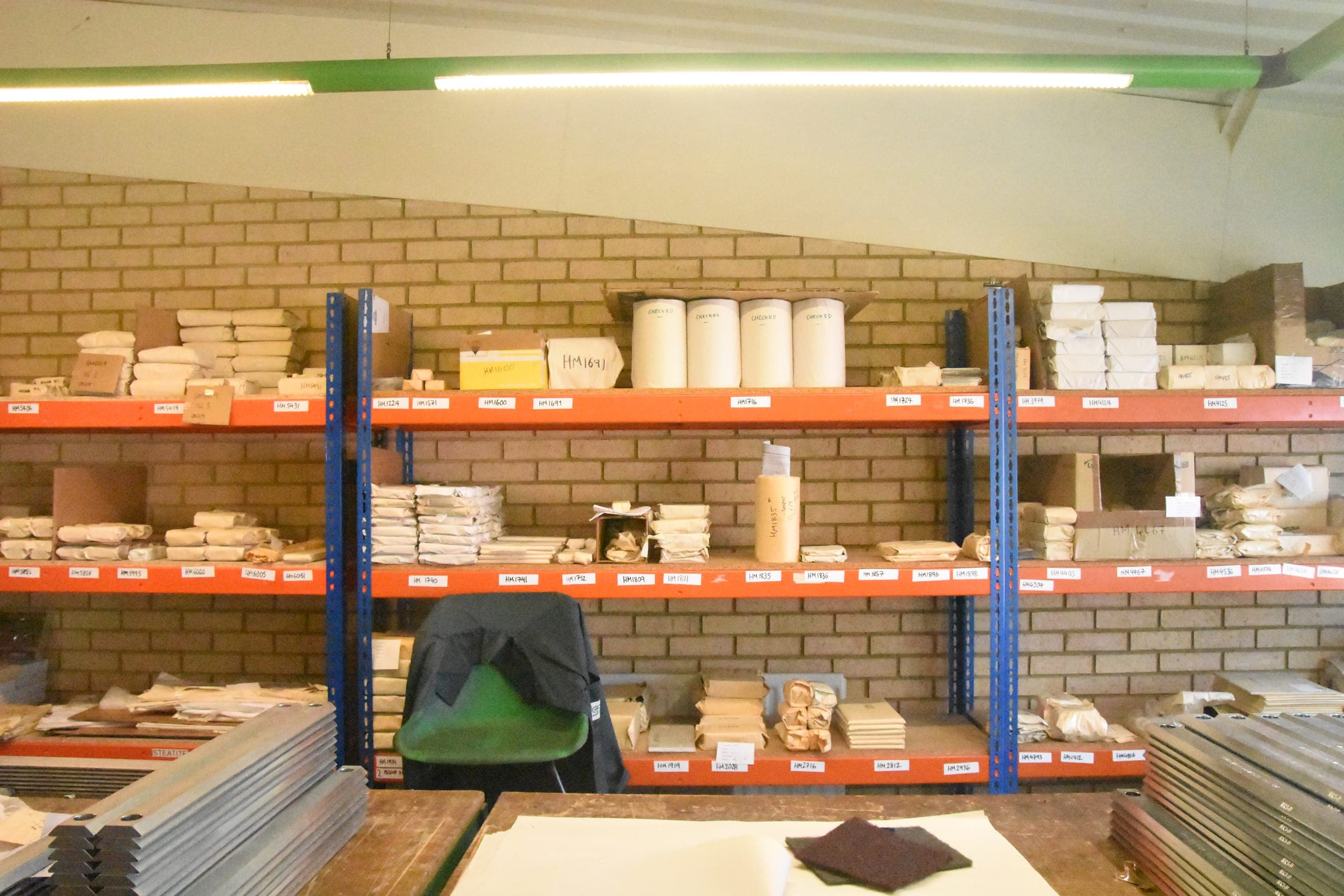 Labelled kanban stock shelves holding finished components ready for scheduled delivery